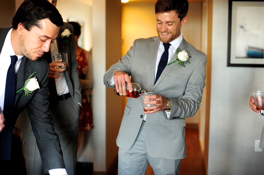 groomsmen pouring shots