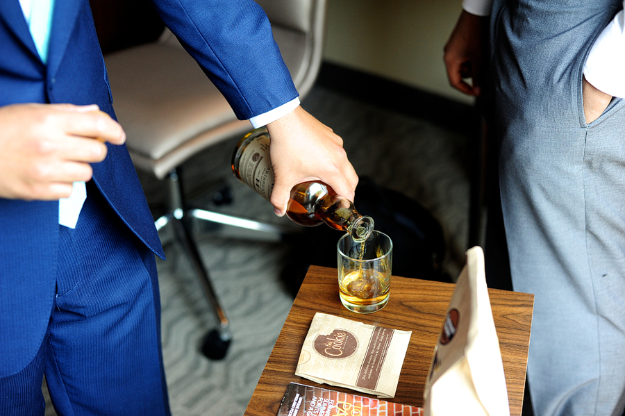 groomsmen pouring whiskey