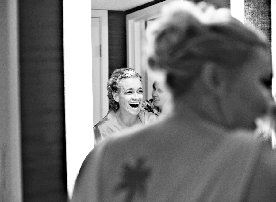 bridesmaids laughing while getting ready