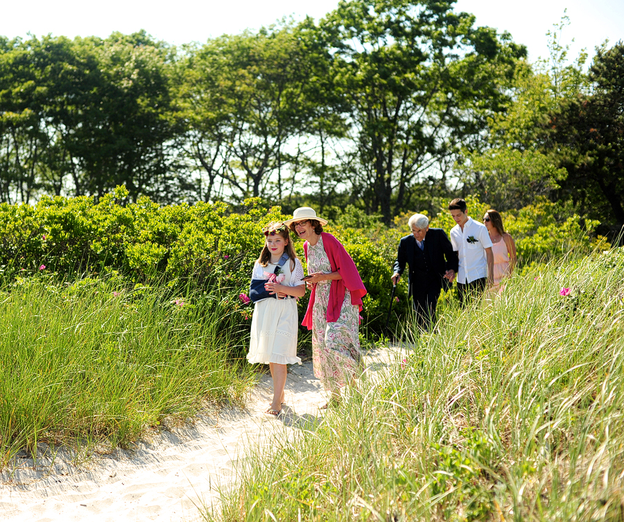 wedding guests walking down to crescent beach