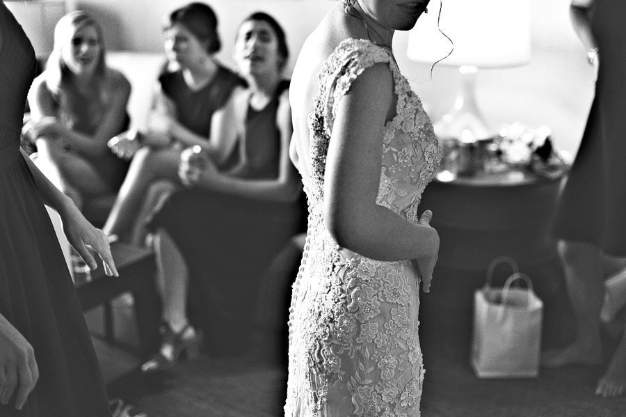 black and white photo of bride getting ready