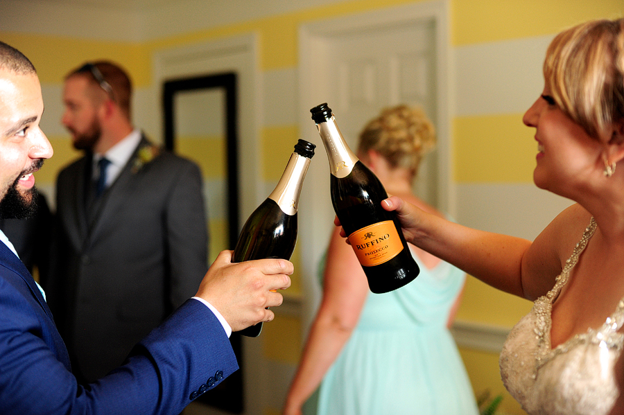 bride and groom toasting with prosecco
