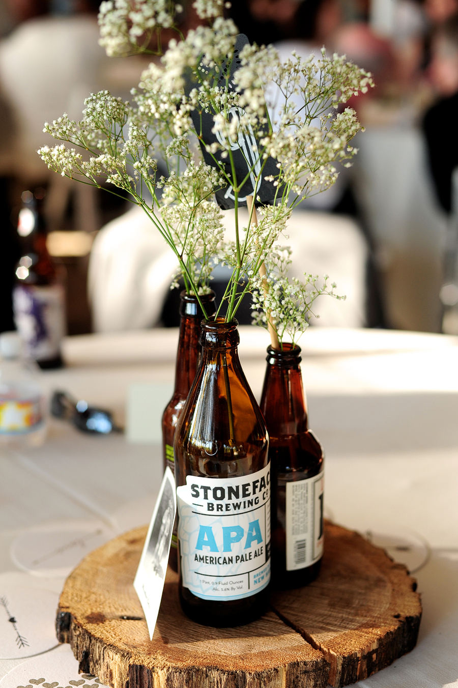 beer bottle centerpiece at a wedding