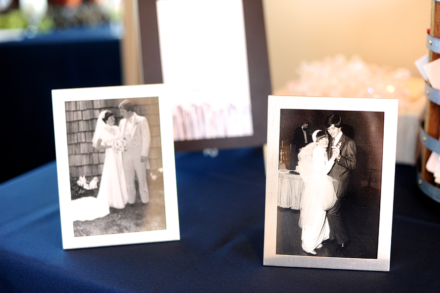old family photos on display at a wedding reception
