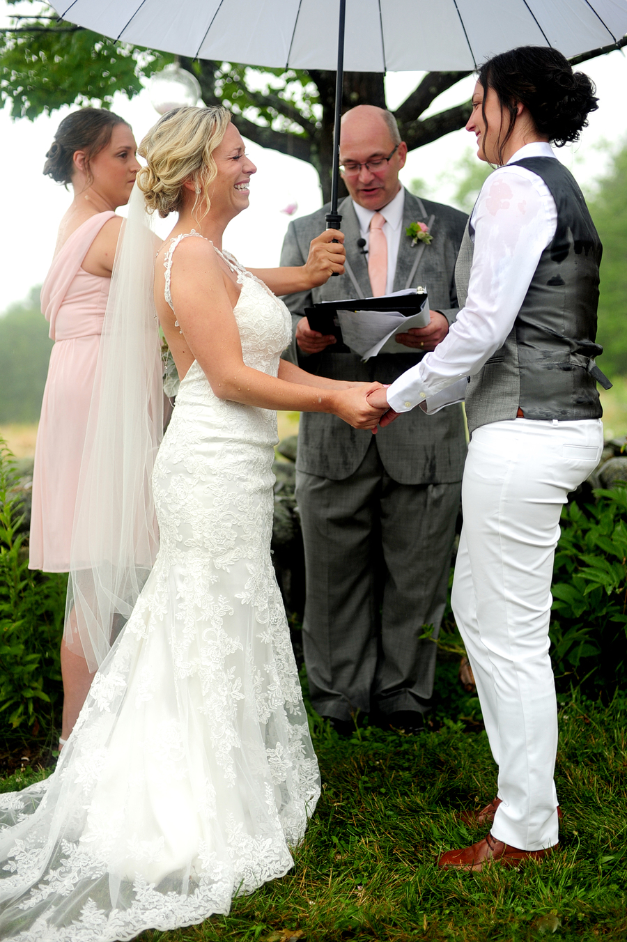 couple saying their vows in the rain