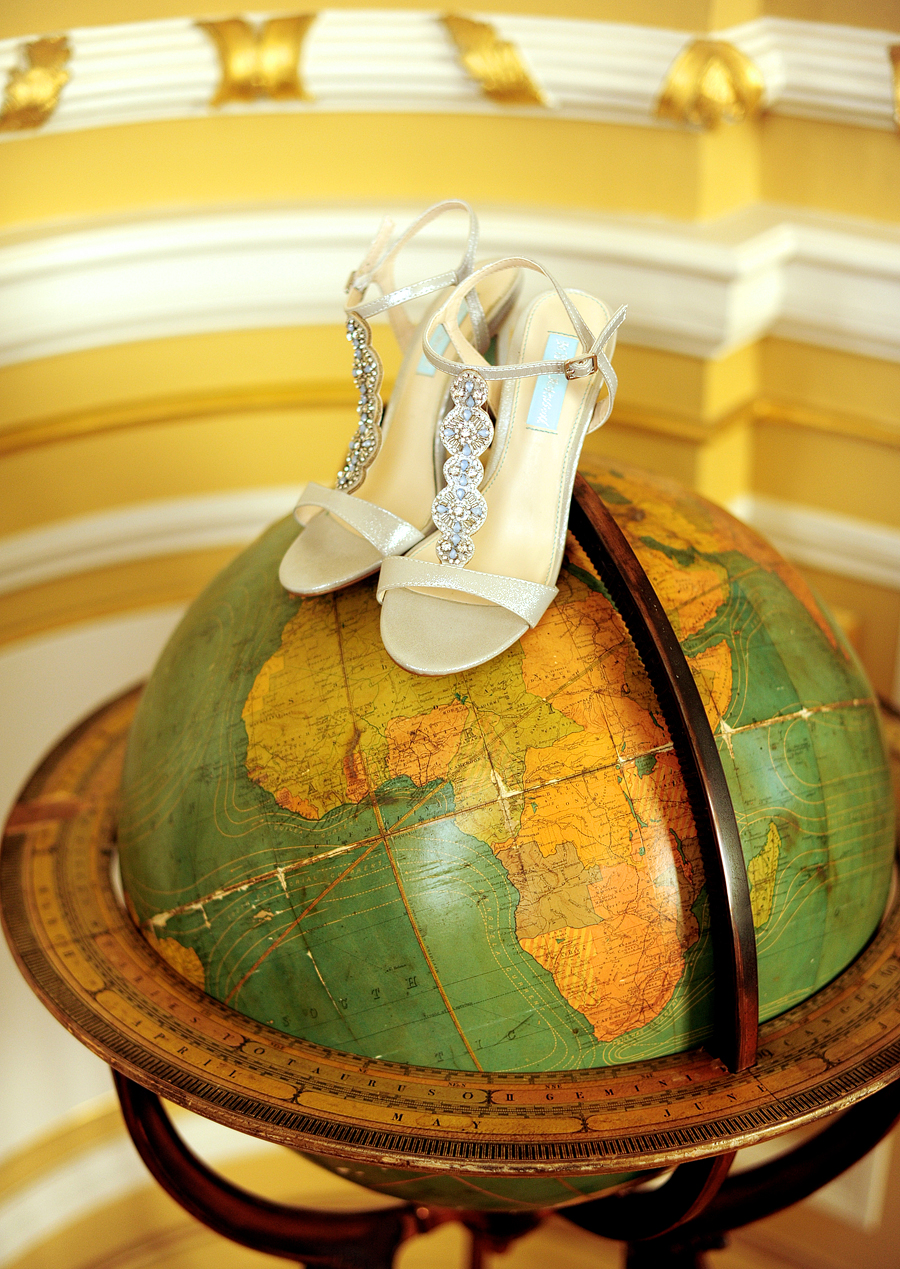 bride's shoes on a globe