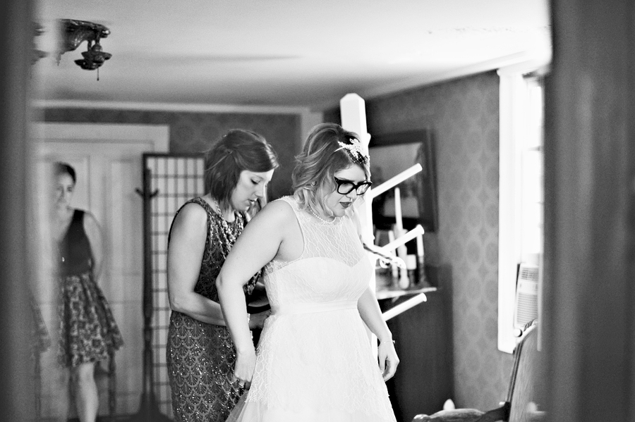 bride in glasses getting ready