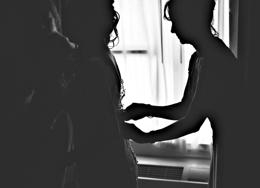 silhouette of bride getting ready
