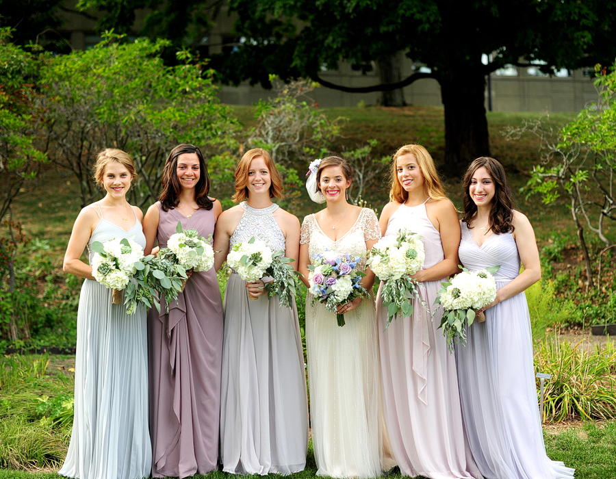 bridesmaids in pastel dresses