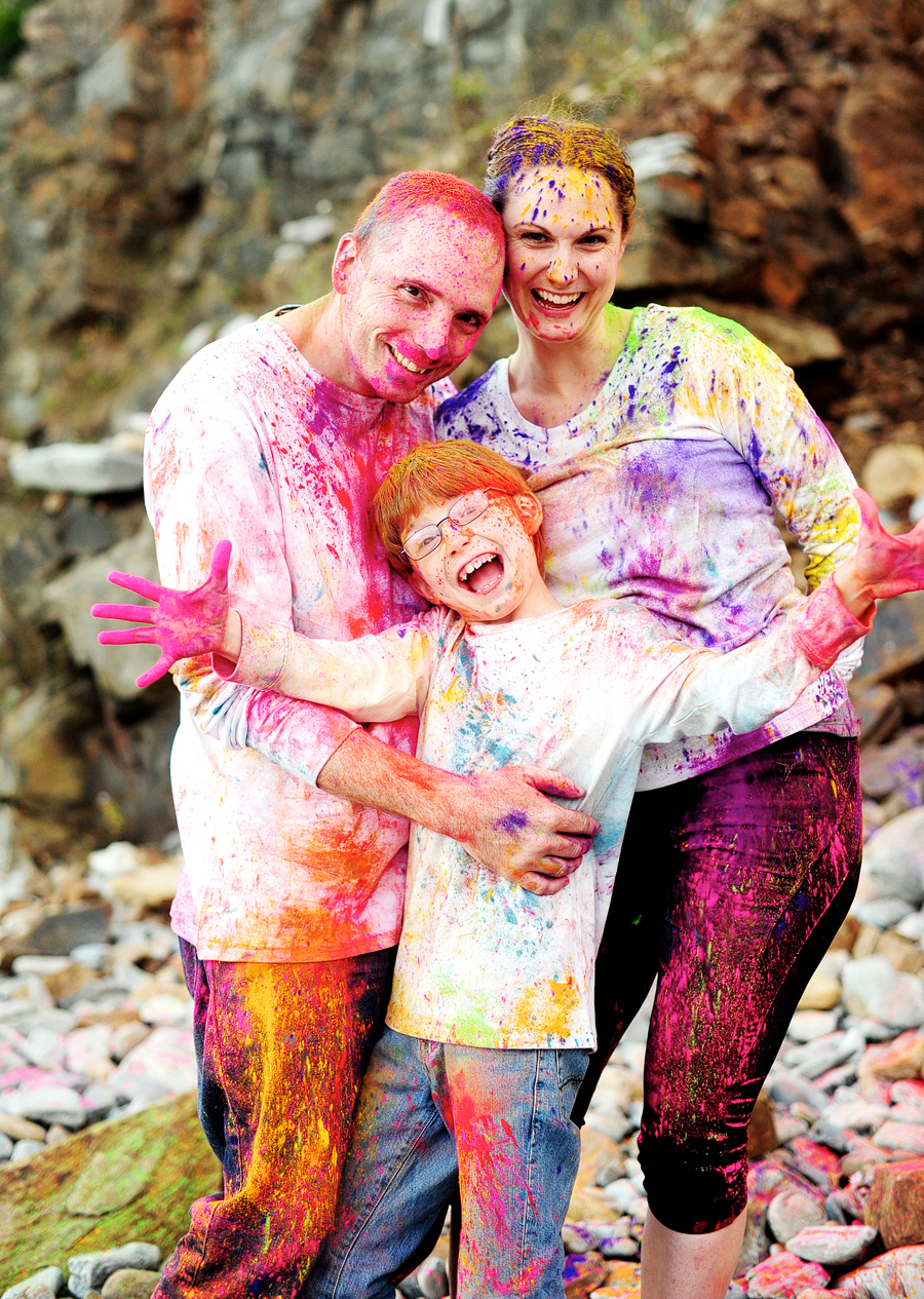 family portraits at fort williams park with colored holi powder