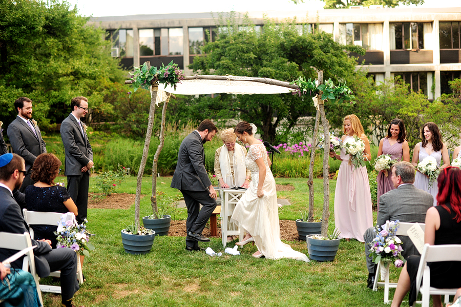 bride and groom breaking the glass