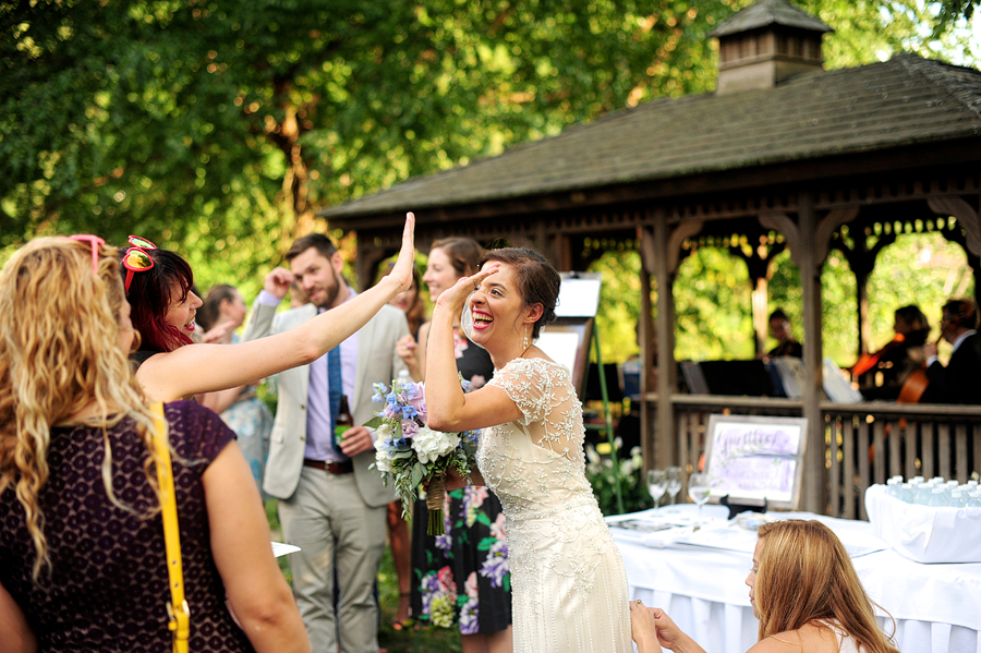 bride high fiving her guests