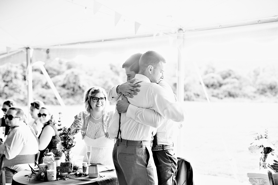 groom hugging his best man