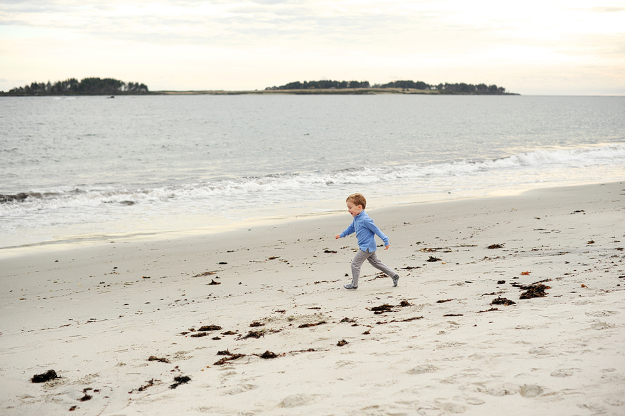 kid running on crescent beach in maine