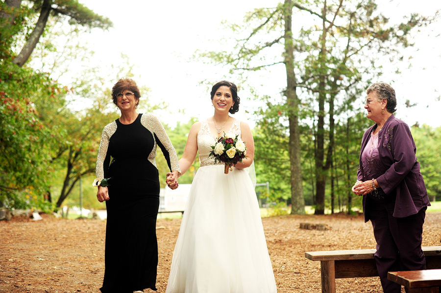 bride walking down aisle with mom